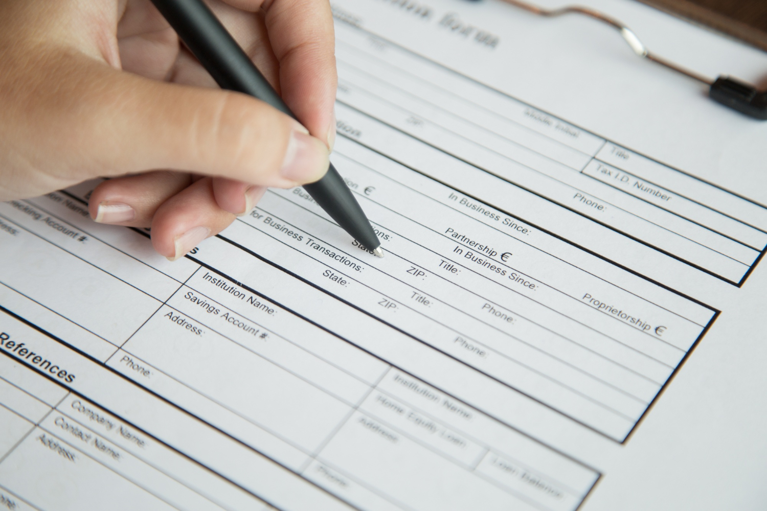Person completing worker classification and payroll paperwork
