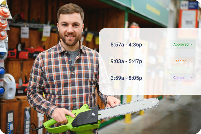 Retail worker holding a power tool.
